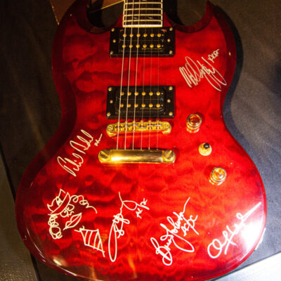 AC/DC signed Red Epiphone SG Prophecy Guitar currently on display and part of a AC/DC exhibition schowcase at the rock'npopmuseum GRONAU https://www.rock-popmuseum.de/